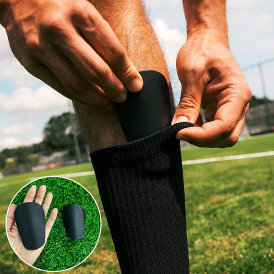 homme en train mettre protege tibia